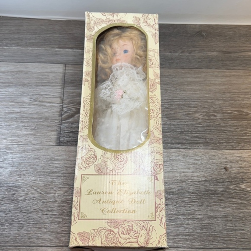 The lawren Elizabeth vintage porcelain Doll with Cream Dress